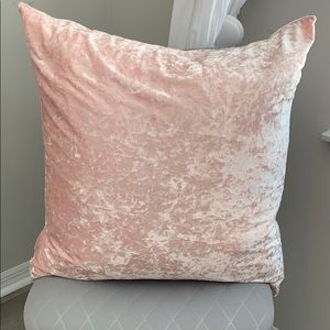 A pink velvet pillow